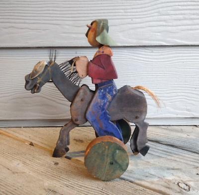 #ad Antique Folk Art Painted Hand Made Wood Cowboy on Bucking Bronco Rolling Toy