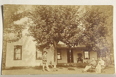 #ad Real Photo Postcard RPPC Unidentified Yard Dog Rests People Sit Push Lawnmower