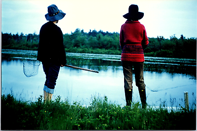 #ad 1970s Photo Pretty Shot Of Two Women Fishing At A Lake In Finland From Behind
