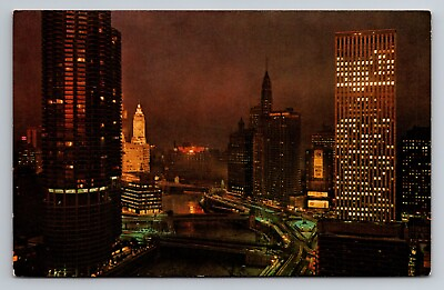 #ad Postcard Marina Towers and United of America Buildings at NightChicagoIllinois $3.99